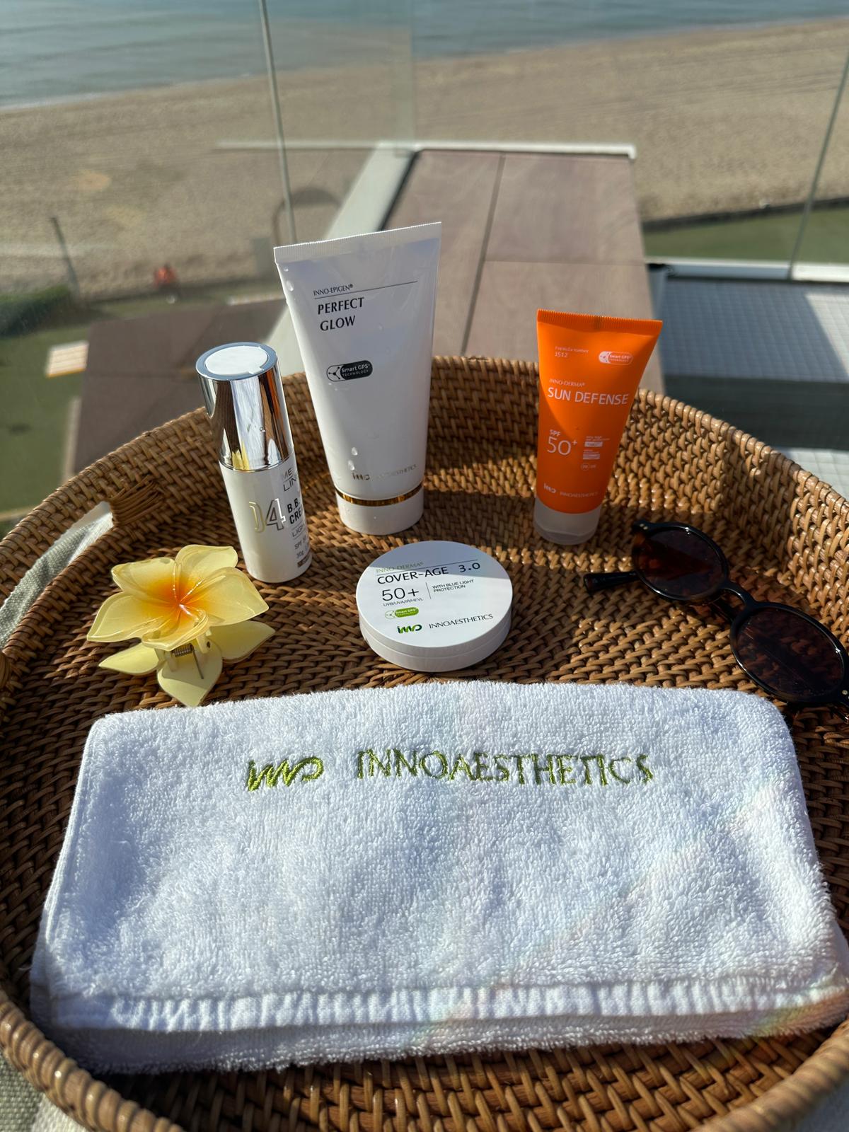 INNO SUN summer routine with sunscreen, towel and lifestyle accessories